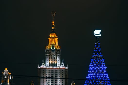 MOSCOW, RUSSIA - DECEMBER 25, 2016: Lomonosov Moscow State University on the background of the Christmas tree, Russia
