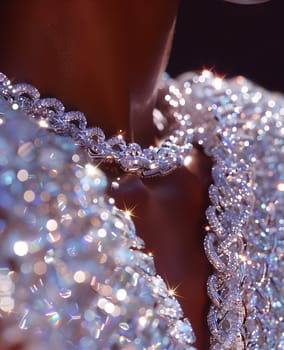 A closeup of a woman with a necklace made of liquid diamonds, resembling dew drops on a terrestrial plant. The electric blue pattern sparkles with moisture like a precious jewel