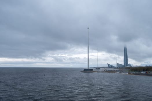 Saint-Petersburg, Russia. - May 10, 2024 View of the modern high-rise building of the Lakhta Center complex against the backdrop of a dramatic sky. Selective focus.