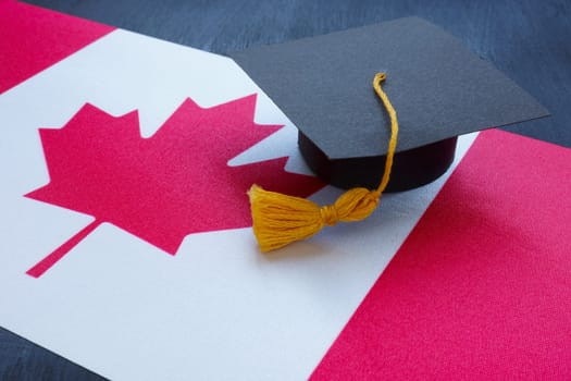 Canada flag and small graduation cap on it.