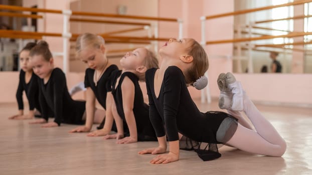 Five little girls doing basket exercise