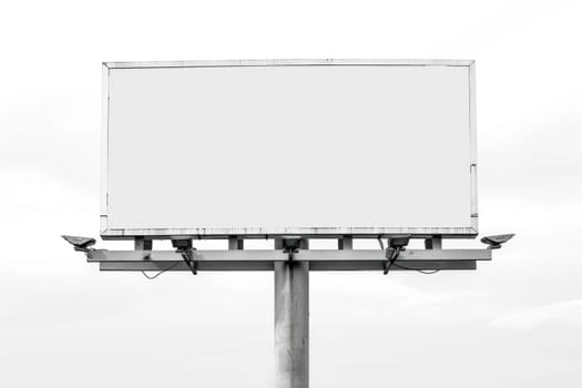 blank white billboard with lithts on white background.