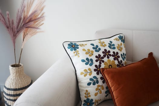 modern sofa with pillows in living room at home.