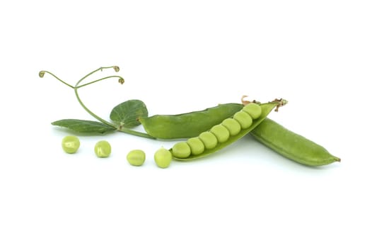 Open pea pod and round green peas inside in close up isolated on white background