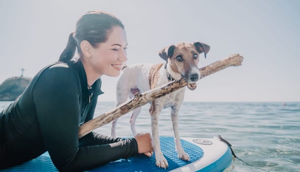 Sea woman sup. A happy positive woman in hat with family relaxing in sea, aerial back view of family on SUP board floating on calm water. Active lifestyle at sea. Summer vacation. Slow motion