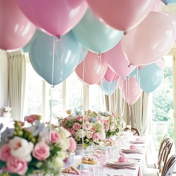 Birthday table decoration with sweets, flowers, candles and pink balloons. Selective focus