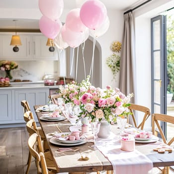 Birthday table decoration with sweets, flowers, candles and pink balloons. Selective focus