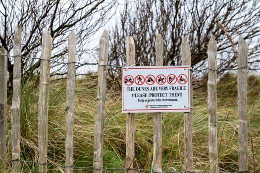 MURVAGH, COUNTY DONEGAL, IRELAND - JANUARY 21 2022 : Sign explaining that the dunes are very fragile.