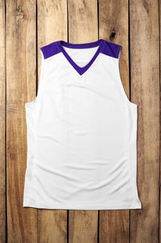 Basketball uniform on wooden background top view flat lay