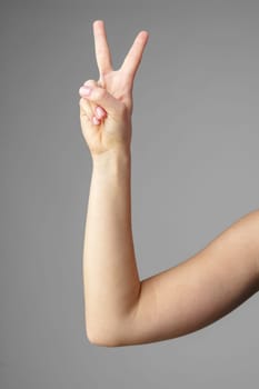 Woman Holding Arm Up in the Air with Gesture close up