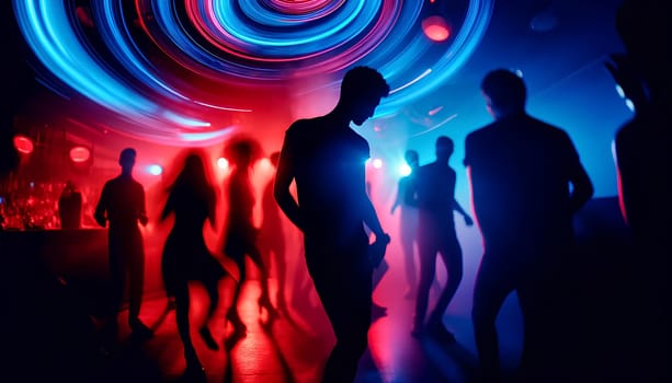 silhouettes of dancing people in a nightclub under bright blue and red abstract club lights.