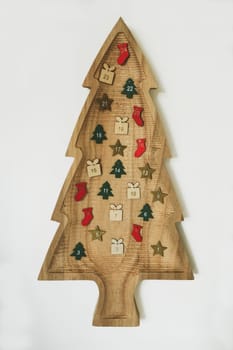 Wooden Christmas tree with hanging 24 numbers Advent calendar