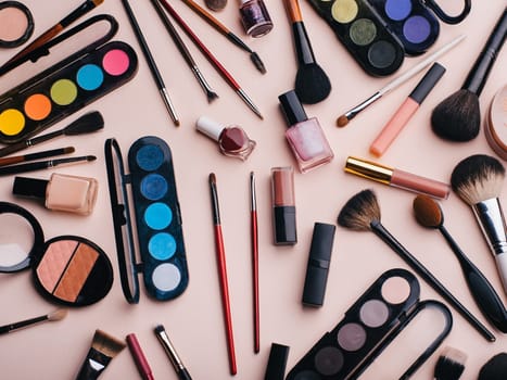 set of female cosmetics for eye makeup, skin face care. Professional products for beauty on a pink background. Top view, flat lay