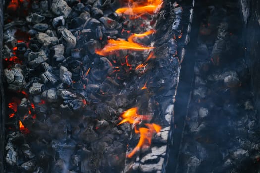 Burning charcoal in the fire for barbecue close-up