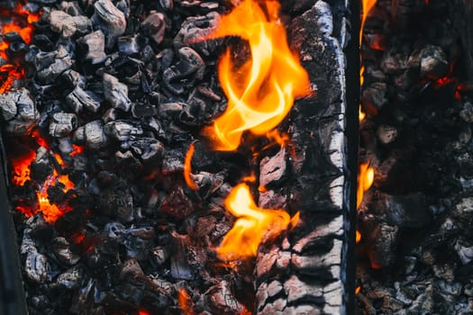 Burning charcoal in the fire for barbecue close-up