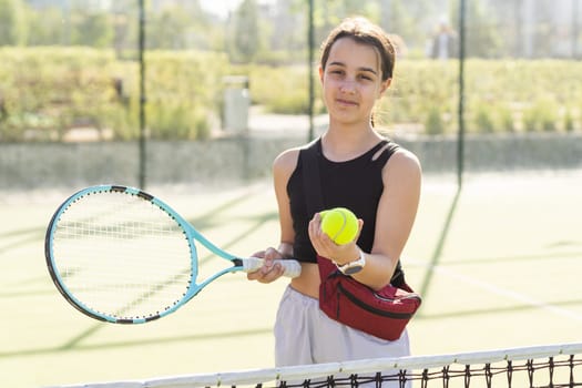 A person holding a racket on a court. High quality photo