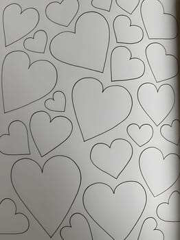 Templates of various sizes of hearts on white card. Heart as a symbol of affection and love. The time of falling in love and love.