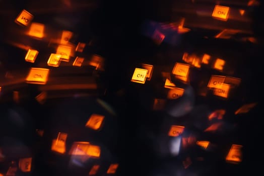DJ mixer in a nightclub with glowing colored lights from controllers and buttons in the nightclub