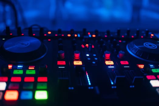 DJ mixer for mixing music and sound in a nightclub at a party