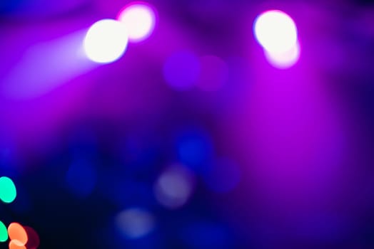 Colorful bokeh background with defocused blurred multicolored light