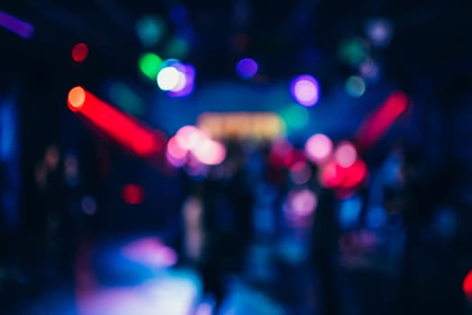 Colorful background with bokeh defocused blurred multicolored lights in a nightclub