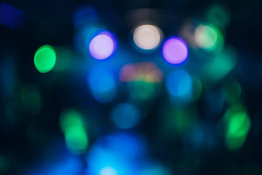 Colorful bokeh background with defocused blurred out lights at night