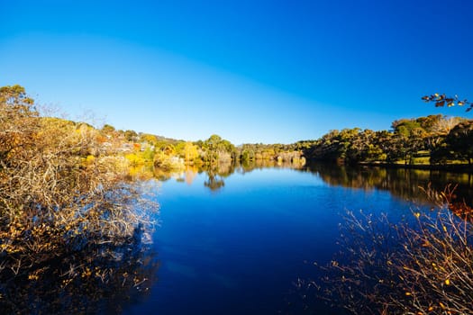 DAYLESFORD, AUSTRALIA - MAY 12 2024: Landscape around Lake Daylesford in a cool late autumn afternoon in Daylesford, Victoria, Australia