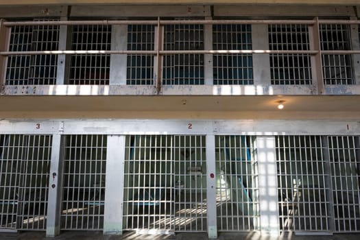 front facing view of prison bars of a jail cell