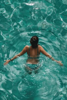 A woman swims in the sea and rests. Selective focus. travel.