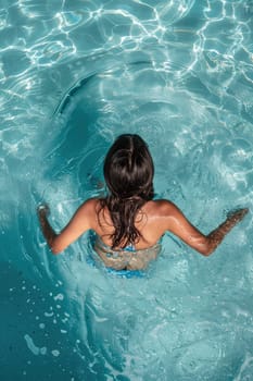 A woman swims in the sea and rests. Selective focus. travel.