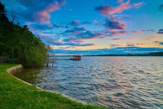 Boathouse on Lake Tyler, Texas with colorful clouds.