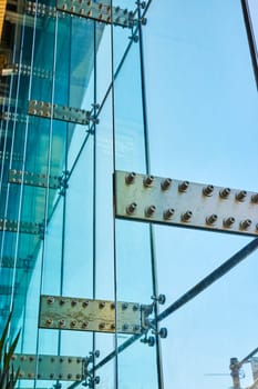 Modern architectural elegance at Grand Wayne Convention Center, Indiana, showcasing glass and steel design against a clear blue sky.