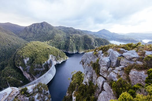 View of the Gordon Dam on a cool summer's day. It is a unique double curvature concrete arch dam with a spillway across the Gordon River near Strathgordon, South West Tasmania, Australia