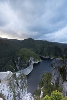 View of the Gordon Dam on a cool summer's day. It is a unique double curvature concrete arch dam with a spillway across the Gordon River near Strathgordon, South West Tasmania, Australia