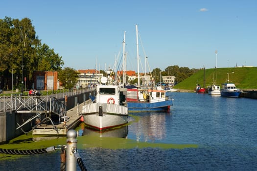 Klaipeda, Lithuania - August 11, 2023: Numerous boats of various sizes floating in a crowded body of water.