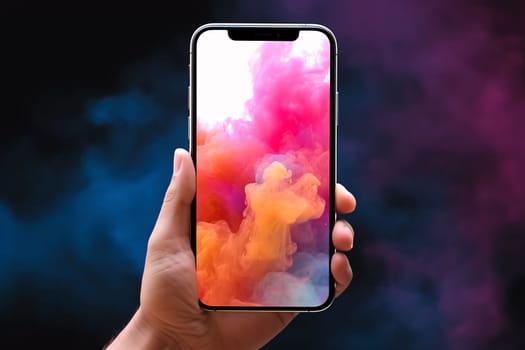 Smartphone screen: male hand holding a smartphone with a colorful cloud of smoke on a black background