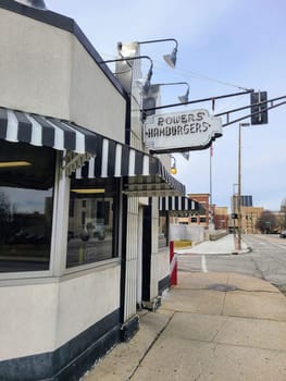 Retro-style Powers Hamburgers diner on a quiet city corner in Fort Wayne, inviting with its nostalgic charm.