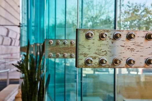 Aged metallic details contrast modern glass at Grand Wayne Convention Center, Fort Wayne.