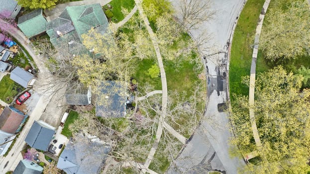 Spring blossoms in a Fort Wayne suburb: lush landscapes and diverse architecture from an aerial view.