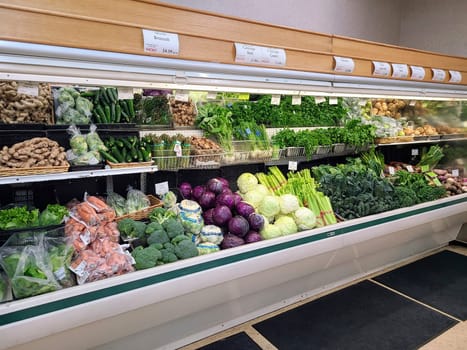 Vibrant grocery store produce section in Fort Wayne, Indiana, featuring fresh, organic vegetables.