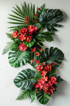 A wall hanging of tropical plants with red flowers.