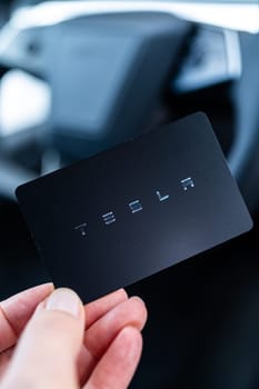 Denver, Colorado, USA-May 5, 2024-his image captures the sleek Tesla Cybertruck key card positioned neatly in the vehicle card holder, highlighting its minimalist design and emphasizing the modern aesthetic of Tesla innovative features.