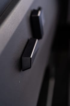 Denver, Colorado, USA-May 5, 2024-This image captures a close-up view of the seat adjustment buttons located in the Tesla Cybertruck, emphasizing the minimalist and sleek design of the vehicle interior controls.