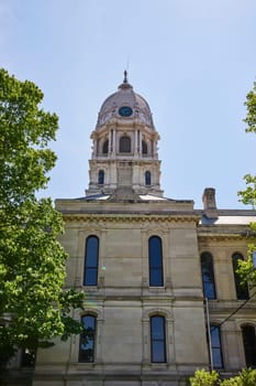 Majestic Kosciusko County Courthouse under a clear blue sky, symbolizing justice and history in Warsaw, Indiana.