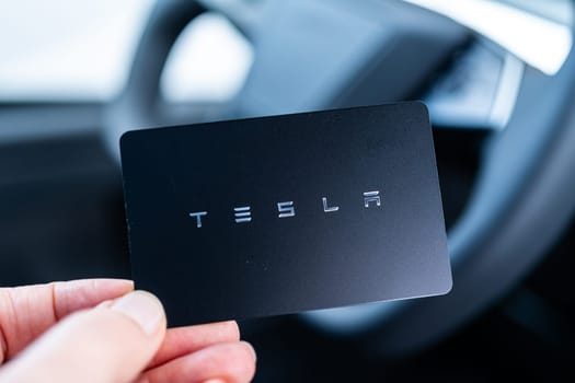 Denver, Colorado, USA-May 5, 2024-his image captures the sleek Tesla Cybertruck key card positioned neatly in the vehicle card holder, highlighting its minimalist design and emphasizing the modern aesthetic of Tesla innovative features.