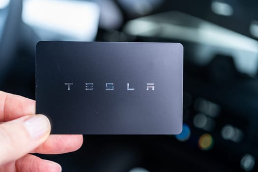 Denver, Colorado, USA-May 5, 2024-his image captures the sleek Tesla Cybertruck key card positioned neatly in the vehicle card holder, highlighting its minimalist design and emphasizing the modern aesthetic of Tesla innovative features.