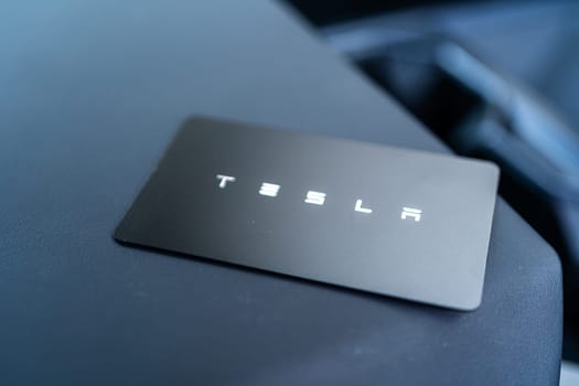 Denver, Colorado, USA-May 5, 2024-his image captures the sleek Tesla Cybertruck key card positioned neatly in the vehicle card holder, highlighting its minimalist design and emphasizing the modern aesthetic of Tesla innovative features.