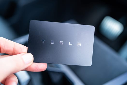 Denver, Colorado, USA-May 5, 2024-his image captures the sleek Tesla Cybertruck key card positioned neatly in the vehicle card holder, highlighting its minimalist design and emphasizing the modern aesthetic of Tesla innovative features.