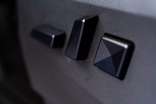 Denver, Colorado, USA-May 5, 2024-This image captures a close-up view of the seat adjustment buttons located in the Tesla Cybertruck, emphasizing the minimalist and sleek design of the vehicle interior controls.