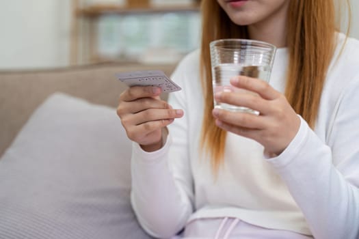 Contraception, menstruation and pregnancy concept, birth control pills asian young woman holding hormonal oral contraceptive pills with calendar, menstrual cycle. Prevention, safe virus sex disease.